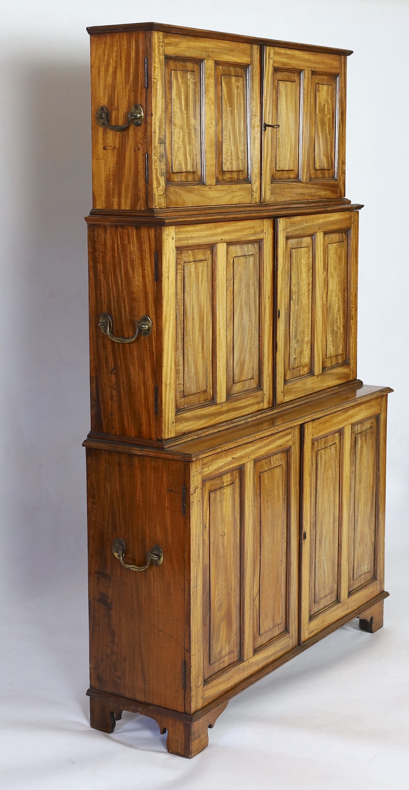 An unusual mid 19th century satinwood campaign bookcase, width 110cm, depth 34cm, height 177cm